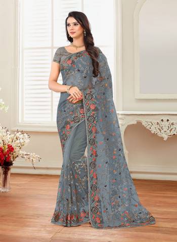 Grab This Heavy Designer Saree For The Upcoming Festive And Wedding Season With This Very Pretty Grey Colored Saree And Blouse. This Saree And Blouse Are Fabricated On Net Beautified With Heavy Embroidery All Over It. 