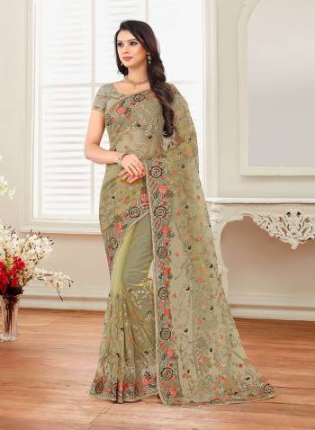 Grab This Heavy Designer Saree For The Upcoming Festive And Wedding Season With This Very Pretty Pastel Green Colored Saree And Blouse. This Saree And Blouse Are Fabricated On Net Beautified With Heavy Embroidery All Over It. 