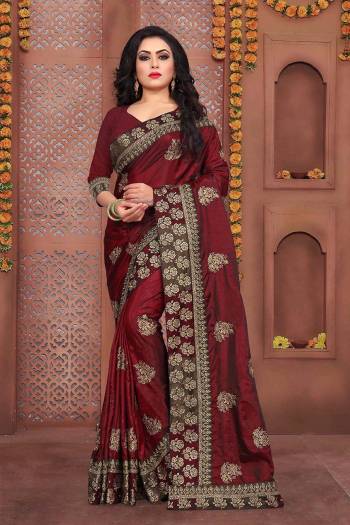 Here Is A Beautiful Designer Saree In Maroon Color Paired With Maroon Colored Blouse. This Saree And Blouse Are Fabricated On Art Silk Beautified With Jari Embroidery And Stone Work. Buy Now.