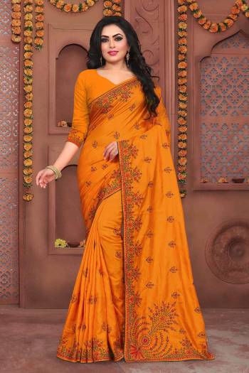 Flaunt Your Rich And Elegant Taste Wearing This Designer Embroidered Saree In Musturd Yellow Color Paired With Musturd Yellow Colored Blouse. This Saree And Blouse Are Fabricated On Art Silk Beautified With Thread Embroidery And Stone Work.