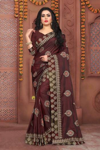 Grab This Beautiful Designer Saree In Brown Color Paired With Brown Colored Blouse. This Saree And Blouse Are Silk based Beautified With Jari Embroidery And Stone Work. It Is Suitable For Festive Or Party Wear.