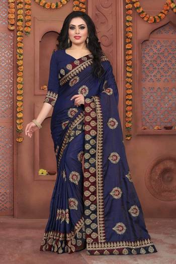 Grab This Beautiful Designer Saree In Navy Blue Color Paired With Navy Blue Colored Blouse. This Saree And Blouse Are Silk based Beautified With Jari Embroidery And Stone Work. It Is Suitable For Festive Or Party Wear.