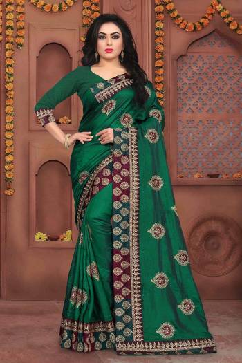 Grab This Beautiful Designer Saree In Dark Green Color Paired With Dark Green Colored Blouse. This Saree And Blouse Are Silk based Beautified With Jari Embroidery And Stone Work. It Is Suitable For Festive Or Party Wear.