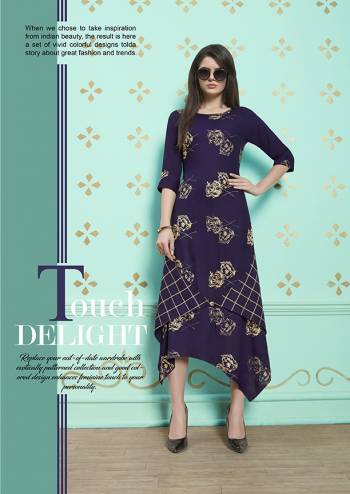 Assymetric Patterned Designer Readymade Kurti Is Here In Navy Blue Color Fabricated On Rayon Cotton Beautified With prints. This Pretty Kurti Is Available In All Regular Sizes. 