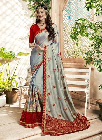 Flaunt Your Rich And Elegant Taste Wearing This Designer Grey Colored Saree Paired With Contrasting Red Colored Blouse. This Saree Is Fabricated On Georgette Paired With Art Silk Fabricated Blouse. 