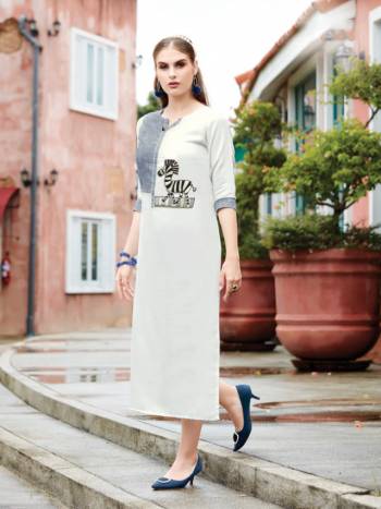 Grab This Designer Readymade Kurti For Your Semi-Casual Wear In White And Grey Color Fabricated On Linen Beautified With Patch Work.