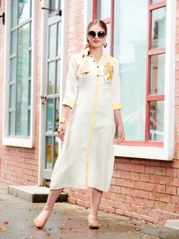 Here Is A Simple And Elegant Designer Readymade Kurti Is Here In White And Yellow Color Fabricated On Linen. It Is Beautified with Pretty Patch Work And Available In All Regular Sizes. 