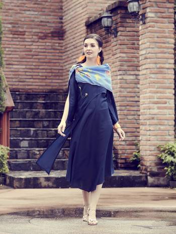 Assymetric Patterned Designer Drape Patterned Readymade Kurti Is Here In Navy Blue Color Paired With Contrasting Blue Colored Stole. This Kurti IS Silk Based With Muslin Fabricated Printed Stole. 