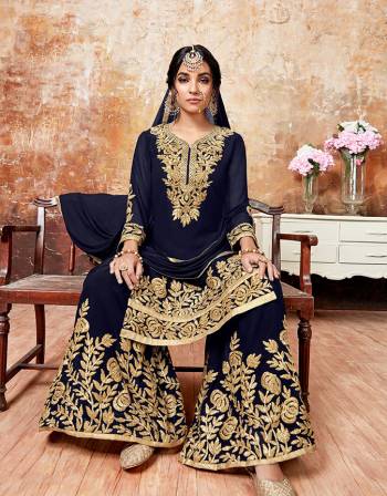 Here Is A Beautiful Designer Sharara Suit For The Upcoming Festive And wedding Season. Its Top And Bottom Are Georgette Based Paired With Chiffon Dupatta. It Is Beautified With Gota Ribbon Work All Over. 