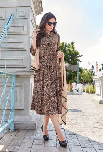 Rich And Elegant Looking Designer Kurti Is Here In Brown Color Fabricated On Pashmina Beautified With Prints And Buttons. It Is Light Weight And Easy To Carry All Day Long. 