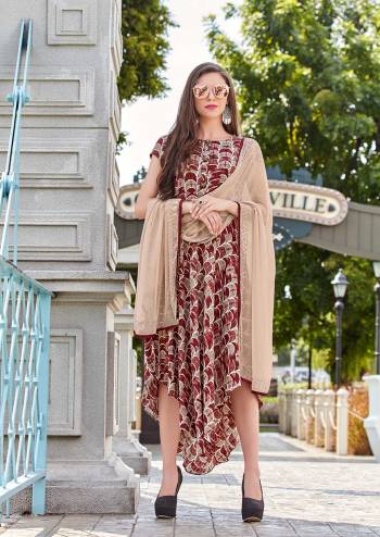 You Will Earn Lots Of Compliments Wearing This Readymade Designer Kurti In Beige And Maroon Color. This Kurti IS Pashmina Based Beautified With Prints And Available In All Regular Sizes. 