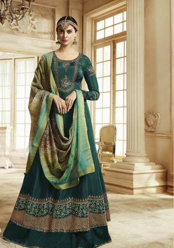 Add This New Shade To Your Wardrobe With This Designer Floor Length Suit In Teal Green Color Paired With Multi Colored Dupatta. Its Top Is Fabricated On Soft Silk Paired With Santoon Bottom And Georgette Dupatta. This Suit Is Light In Weight And Easy To Carry All Day Long. 