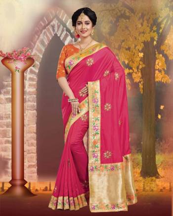 Shine Bright In this Silk Based Dark Pink Colored Saree Paired With Contrasting Orange Colored Blouse. It Is Beautified With Weave And Jari Embroidery. 