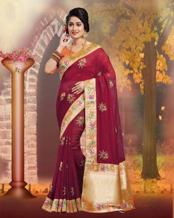 For A Royal Look, Grab This Silk Based Saree In Maroon Color Paired With Contrasting Orange Colored Blouse. This Saree And Blouse Are Fabricated on Art Silk Which IS Durable And Easy To Carry All Day Long.