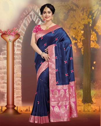 Enahance Your Personality Wearing This Silk Based Saree In Navy Blue Color Paired With Contrasting Dark Pink Colored Blouse. This Saree And Blouse Are Fabricated On Art Silk Which Gives A Rich Look To Your Personality. 