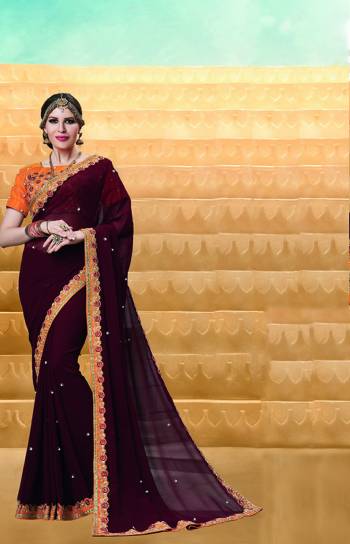 Enhance Your Personality Wearing This Designer Saree In Brown Color Paired With Contrasting Orange Colored Blouse. This Saree Is Fabricated On Georgette Paired With Art Silk Fabricated Blouse. It Is Light In Weight And Easy To Carry All Day Long. 