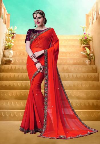 Celebrate This Festive Season Wearing This Designer Saree In Orange Color Paired With Contrasting Brown Colored Blouse. This Saree Is Fabricated On Georgette Paired With Art Silk Fabricated Blouse. It Is Light In Weight And Easy To Drape Which Is Easy To Carry All Day Long. 