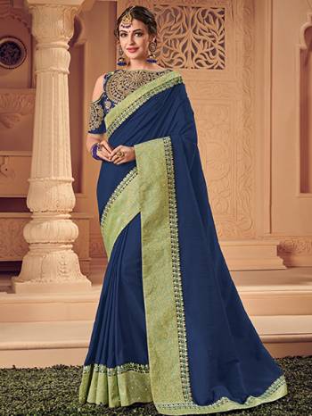 Bring out the best in you when wearing this Blue color two tone banarasi silk saree. Ideal for party, festive & social gatherings. this gorgeous saree featuring a beautiful mix of designs. Its attractive color and heavy designer saree, attractive Designs, stone design, beautiful floral design work over the attire & contrast hemline adds to the look. Comes along with a contrast unstitched blouse.