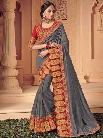 Look your ethnic best by wearing this Dark grey color two tone silk saree. Ideal for party, festive & social gatherings. this gorgeous saree featuring a beautiful mix of designs. Its attractive color and heavy designer saree, attractive Designs, stone design, beautiful floral design work over the attire & contrast hemline adds to the look. Comes along with a contrast unstitched blouse.