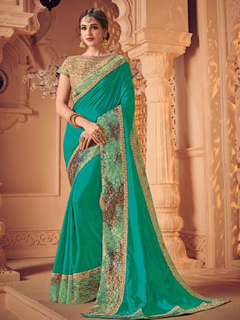 You Look elegant and stylish this festive season by draping this Sea green color two tone silk saree. Ideal for party, festive & social gatherings. this gorgeous saree featuring a beautiful mix of designs. Its attractive color and heavy designer saree, attractive Designs, stone design, beautiful floral design work over the attire & contrast hemline adds to the look. Comes along with a contrast unstitched blouse.