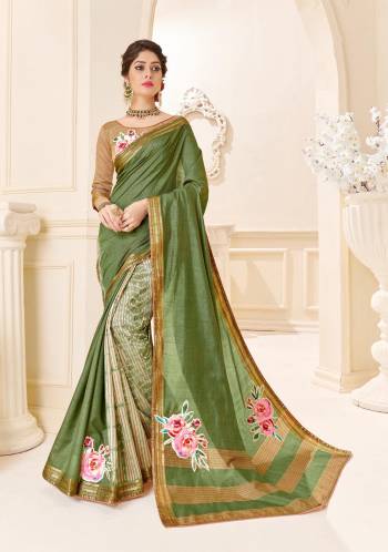 Celebrate This Festive Season Wearing This Saree In Green Color On Silk Based Fabric. It Is Beautified With Printed And Patch Work. Buy Now.