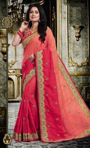 Attract All In This Very Pretty Peach And Red Colored Saree Paired With Red Colored Blouse. This Saree And Blouse Are Silk Based Beautified With Heavy Embroidery All Over. 