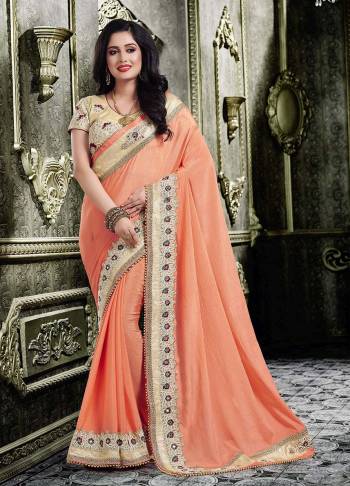 A Must Have Shade In Every Womens Wardrobe Is Here With This Designer Saree In Peach Color Paired With Beige Colored Blouse. This Pretty Saree IS Chiffon Based Paired With Art Silk Fabricated Blouse. Buy Now.