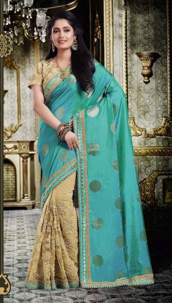 Grab This Lovely Designer Saree In Blue And Beige Color Paired With Beige Colored Blouse. This Saree And Blouse Are Silk Based Beautified With Embroidery Making It More Attractive. 