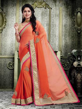 Celebrate This Festive Season Wearing This Designer Saree In Orange Color Paired With Beige Colored Blouse. This Saree Is Chiffon Based Paired With Art Silk Fabricated Blouse, Beautified With Embroidery And Weave. 