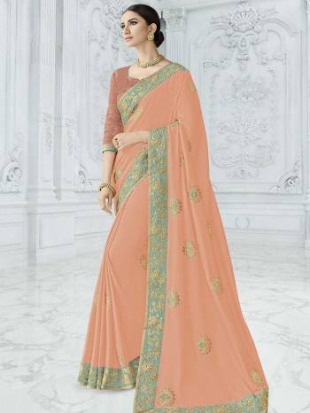 Wear this peach color silk fabrics saree. Ideal for party, festive & social gatherings. this gorgeous saree featuring a beautiful mix of designs. Its attractive color and designer heavy embroidered design, Flower embroidered butta design, sequence design, beautiful floral design work over the attire & contrast hemline adds to the look. Comes along with a contrast unstitched blouse.