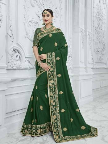 Bring out the best in you when wearing this Dark green color silk fabrics saree. Ideal for party, festive & social gatherings. this gorgeous saree featuring a beautiful mix of designs. Its attractive color and designer heavy embroidered design, Flower embroidered butta design, sequence design, beautiful floral design work over the attire & contrast hemline adds to the look. Comes along with a contrast unstitched blouse.