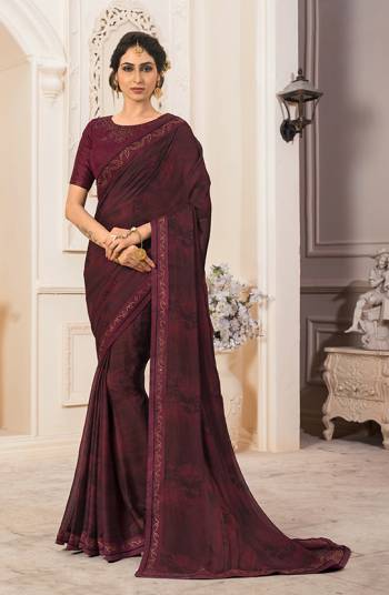 New Shade Is Here To Add Into Your Wardrobe With This Designer Saree In Wine Color Paired With Wine Colored Blouse. This Saree Is Fabricated On Georgette Chiffon Paired With Art Silk Fabricated Blouse. Its Rich Color And Fabric Will Earn You Lots Of Compliments From Onlookers. 