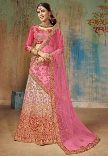 Shine Bright Wearing This Heavy Designer Lehenga Choli In Dark Pink Colored Blouse Paired With Pastel Pink Lehenga And Pink Colored Dupatta. Its Blouse And Lehenga Are Satin Silk Based Paired With Net Fabricated Dupatta. It Is Beautified With Heavy Embroidery All Over. 