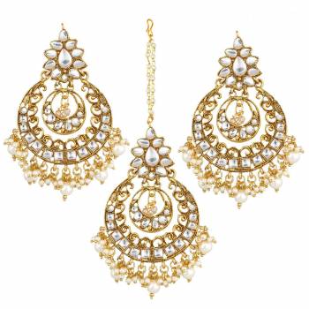 Give Unique And Attractive Look To Your Traditional Attire By Pairing It With This Beautiful Set Of Maang Tika And Earrings. This Pretty Set Can Be Paired With Any Colored Traditional Attire. Buy Now.