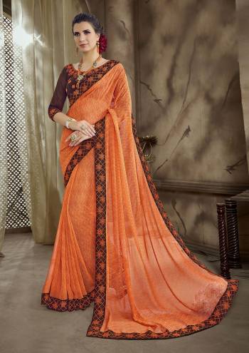 Look Beautiful Wearing This Bright Orange Colored Saree Paired With Contrasting Brown Colored Blouse. This Saree IS Georgette Based Paired With Art Silk Fabricated Blouse. 