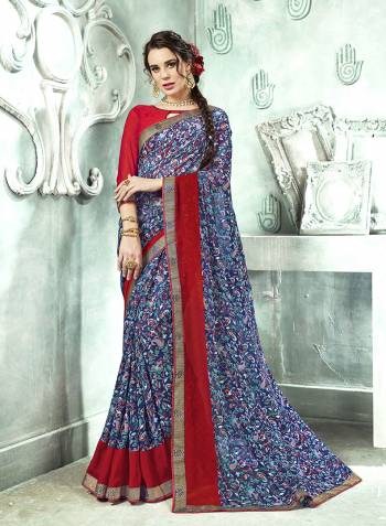 Bright And Appealing Color Is Here With This Saree In Blue Color Paired With Red Colored Blouse. This Saree And Blouse are Georgette Based Beautified With Prints And Lace Border. Its Fabrics Ensures Superb Comfort All Day Long. 