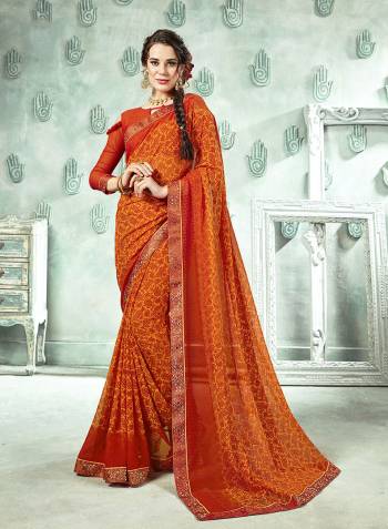 Traditional Color Is Here With This Saree In Orange And Yellow Color Paired With Orange Colored Blouse. This Saree And Blouse Are Georgette Based Beautified With Prints And Lace Boder. 