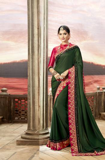 Bright And Visually Appealing Color Is Here With This Designer Saree In Dark Green Color Paired With Contrasting Dark Pink Colored Blouse. This Saree Is Fabricated On Satin Georgette Paired With Art Silk Fabricated Blouse.Both The Fabrics Ensures Superb Comfort All Day Long. 