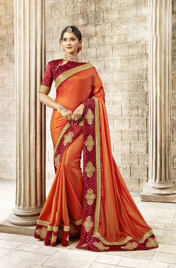 Celebrate This Festive Season With Traditional Color Pallete With This Desigfner Saree In Orange Color Paired With Contrasting Red Colored Blouse. This Saree Is Satin Silk Fabricated Paired With Art Silk Fabricated Blouse. It Is Light In Weight And Easy To Carry All Day Long. 