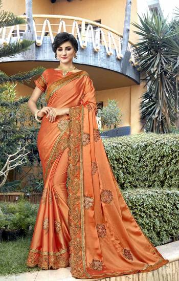 Celebrate This Festive And Wedding Season Wearing This Designer Saree In Orange Color Paired With Orange Colored Blouse. This Saree Is Fabricated On Satin Paired With Art Silk Fabricated Blouse. It Is Soft Towards Skin And Easy To Carry All Day Long. 