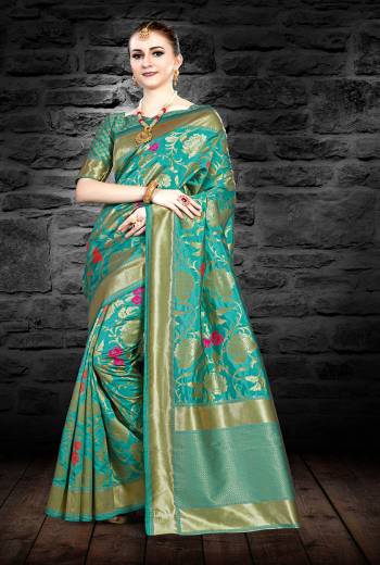 Look Pretty Draping This Saree In Sea Green Color Paired With Sea Green Colored Blouse. This Saree And Blouse Are Fabricated On Art Silk Beautified With Weave All Over. 