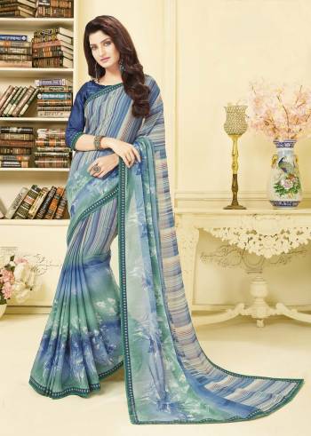 Grab This Pretty Saree For Your Casual Or Semi-Casual Wear. This Saree Is Fabricated On Georgette Paired With Satin Fabricated Blouse. It Is Beautified With Prints All Over. This Kurti Is Light Weight And Easy To Carry All Day Long. 