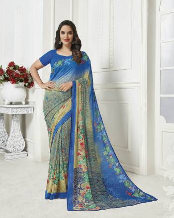 Here Is A Pretty Georgette Based Light Weight Saree For Your Casual Wear. This Saree Is Beautified With Floral Prints All Over And Also It Is Easy To Carry All Day Long. 