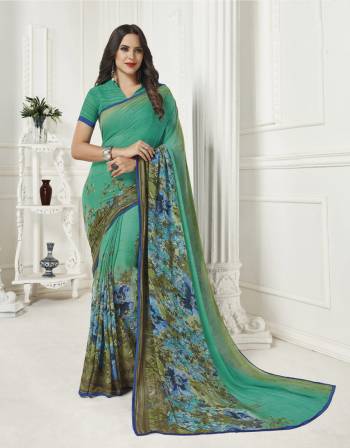 Simple And Elegant Looking Saree Is Here For Your Casual Wear. This Saree And Blouse are Fabricated On Georgette Beautified With Prints All Over. Buy Now.