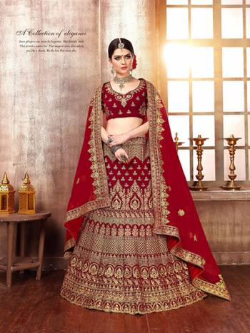 Get Ready For The D-Day With This Heavy designer Lehenga Choli In Full Maroon Color. This Lehenga Choli Is Fabricated On Velvet Paired With Net Fabricated Dupatta. It Is Beautified With Heavy Embroidery Which Is Giving This Lehenga More Graceful Look. 