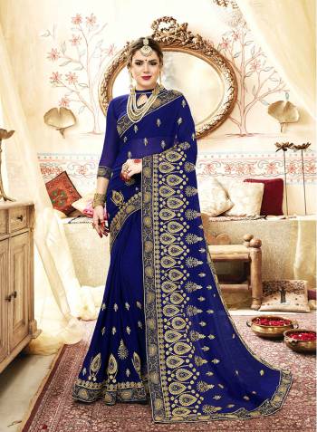 Shine Bright In This Beautiful Designer Saree In Royal Blue Color Paired With Royal Blue Colored Blouse. This Saree And Blouse Are Georgette Based Beautified With Jari And Thread Embroidery With Stone Work.