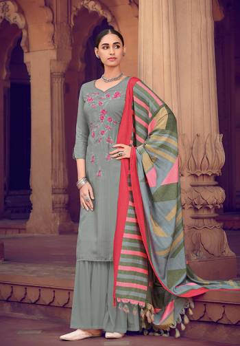 Grey color muslin silk fabric suit comes with matching colored santoon Solid bottom with printed dupatta. This suit is covered with floral print with touc of thread work on top. Team it with a sandles to create a contrasting effect.