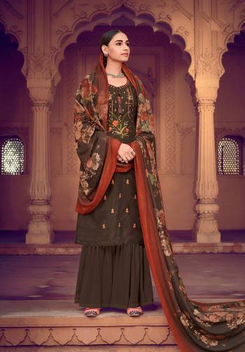 Dark Brown color muslin silk fabric suit comes with matching colored santoon Solid bottom with printed dupatta. This suit is covered with floral print with touc of thread work on top. Team it with a sandles to create a contrasting effect.