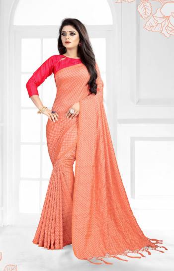 A Must Have Shade In Every Womens Wardrobe Is Here In Peach Color Paired With Dark Pink Colored Blouse. This Saree And Blouse Are Fabricated On Art Silk Beautified With 3D Checks Weave All Over The Saree. 