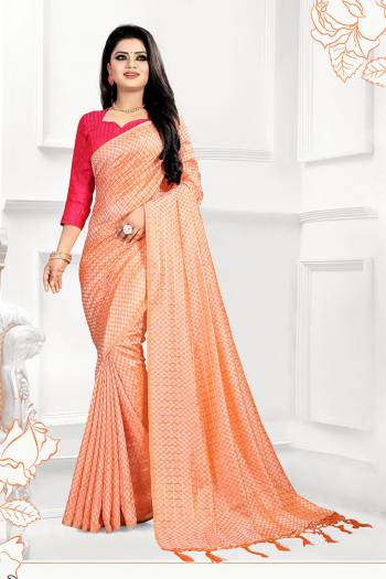 This Festive Season, Look The Most Amazing Of All In this Designer Light Orange Colored Saree Paired With Contrasting Dark Pink Colored Blouse. This Saree And Blouse Are Silk Based Beautified With 3D Checks Weave. 